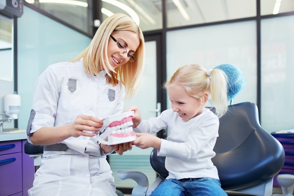 How Soon Should A Child See A Kid Friendly Dentist In Atlantis After Knocking Out A Permanent Tooth?